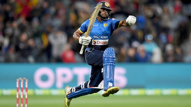 Sri Lanka's Dilshan Munaweera leaves the field after dismissal