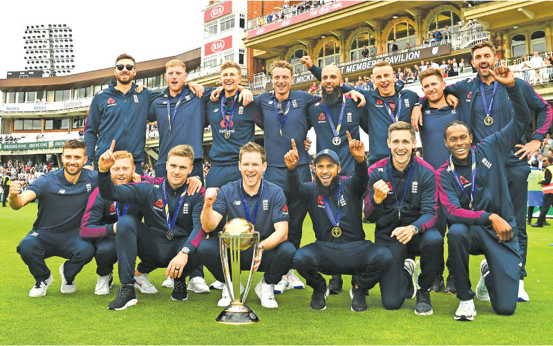 The new World Cup cricket champions England celebrate their victory.  - AFP