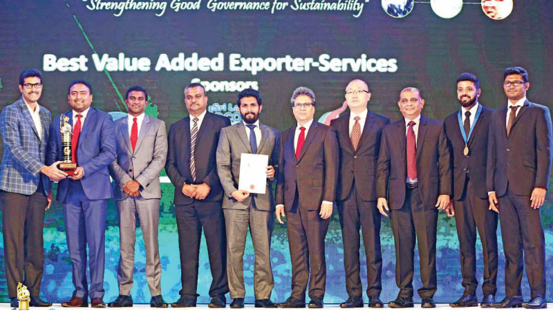 The 99X Technology team with the award for Best Value Added Exporter in the services sector at the awards ceremony