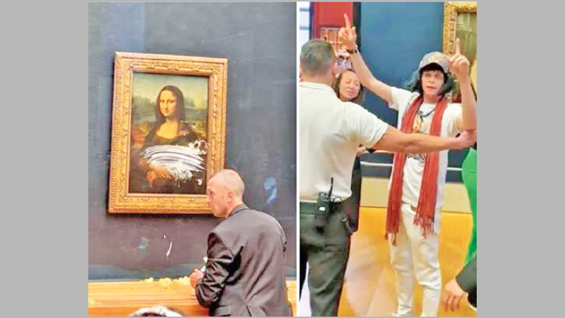 Mona Lisa Attacked in Louvre With Cake By Man Wearing Wig