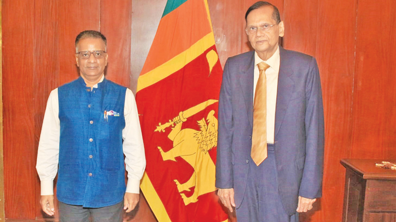 Foreign Minister Prof. G.L. Peiris with Indian High Commissioner Gopal Baglay at the Ministry.   