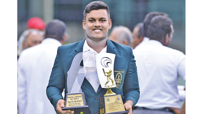 The skipper of Isipathana College Thevindu Dickwella who won Best Striker and Man of the Match awards with his trophies. Picture by Dushmantha Mayadunna