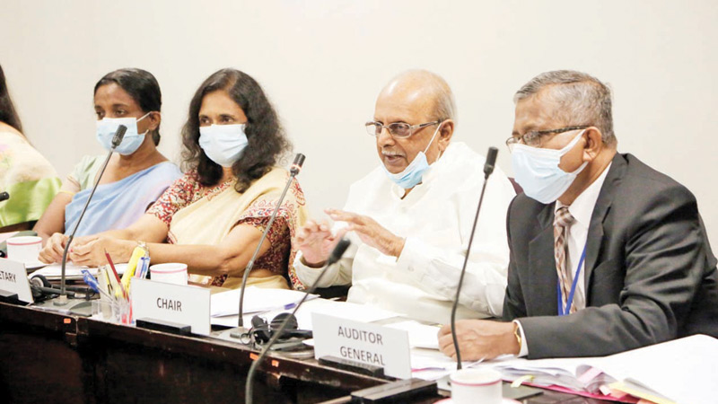 Committee on Public Accounts (COPA) Chairman Prof. Tissa Vitharana chairing the COPA meeting in Parliament on Thursday.