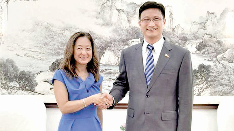 Chinese Ambassador to Sri Lanka Qi Zhenhong (R) met US Ambassador Julie Chung, at the Chinese Embassy in Colombo on June 13, 2022.
