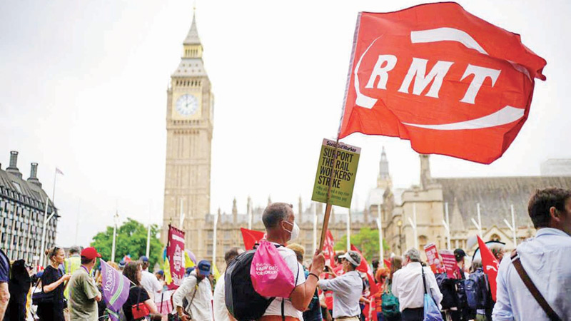 People from different unions and members of the public hold up placards as they take part in a TUC national demonstration in London on Saturday to demand action on the Cost of Living, a new deal for working people and a pay rise for all workers.