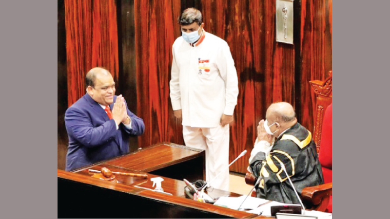 Dhammika Perera was sworn in as a National List Member of Parliament of the Sri Lanka Podujana Peramuna before Speaker Mahinda Yapa Abeywardana yesterday. (Picture by Parliament Media)
