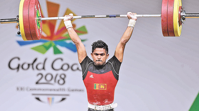Indika Chaturanga in action at a  weightlifting contest. (Pictures. by Upananda  Jayasundera)   