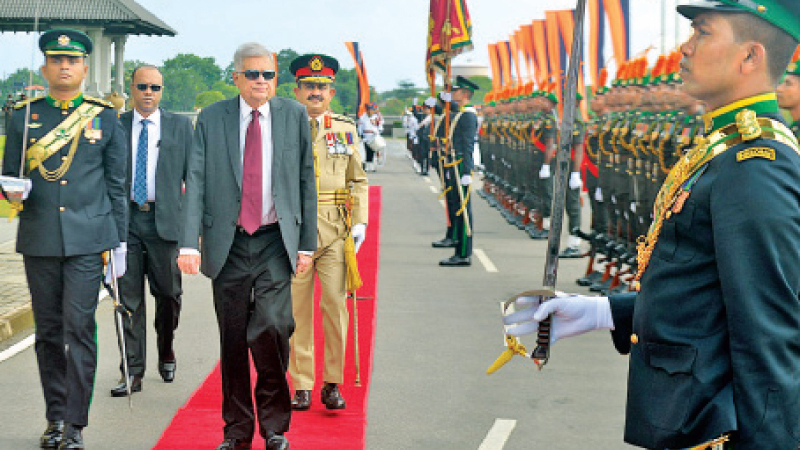President Ranil Wickremesinghe accepting the guard of honour accorded to him at the Army Headquarters when he made an official visit there yesterday. Army Commander Lt.Gen.Vikum Liyanage was present. Picture by Hirantha Gunathilake