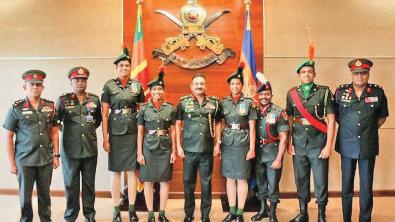 The mystery spinner Maheesh Theekshana (second from right) with Army officials poses the picture at the Army Headquarters.