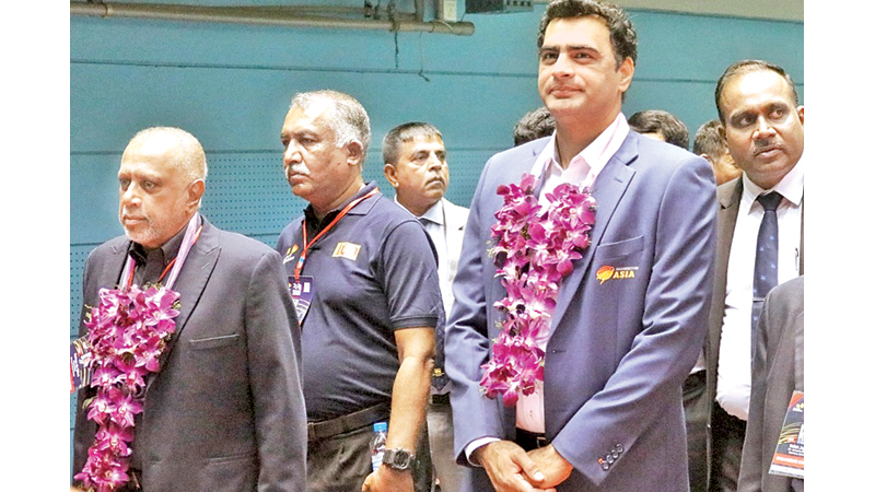 SLB President Rohan de Silva , Vice President Palitha Hettiarachchi, NSSI Director Sajith Jayalal, and Tournament Director Rohana de Silva  accompanying the chief guest Wajid Ali Chaudhry, Chairman of Badminton Asia Development, Committee to the opening ceremony yesterday.