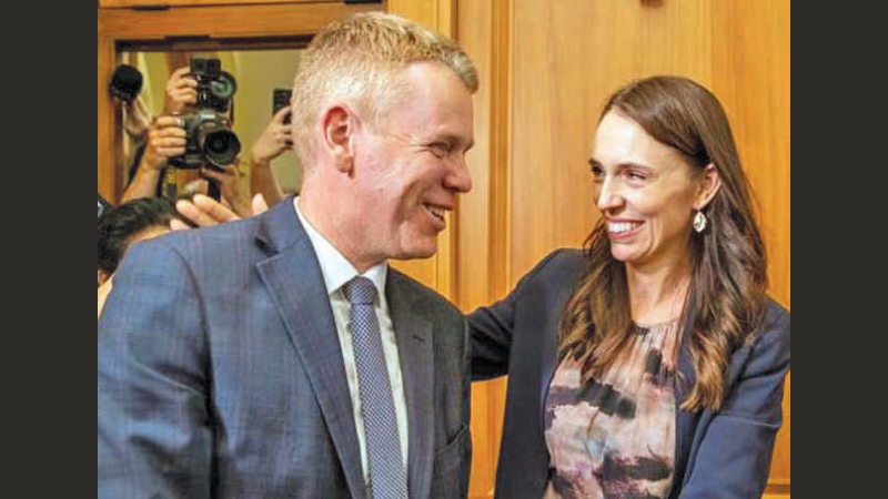 Outgoing New Zealand Prime Minister Jacinda Ardern, and new Labour Party Leader and Prime Minister Chris Hipkins arrive for their caucus vote at Parliament in Wellington.