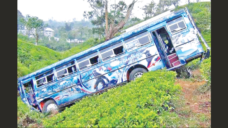 The bus went down the precipice after the collision. Pictures by Ranjith Rajapaksa and Chandana Jayaweera