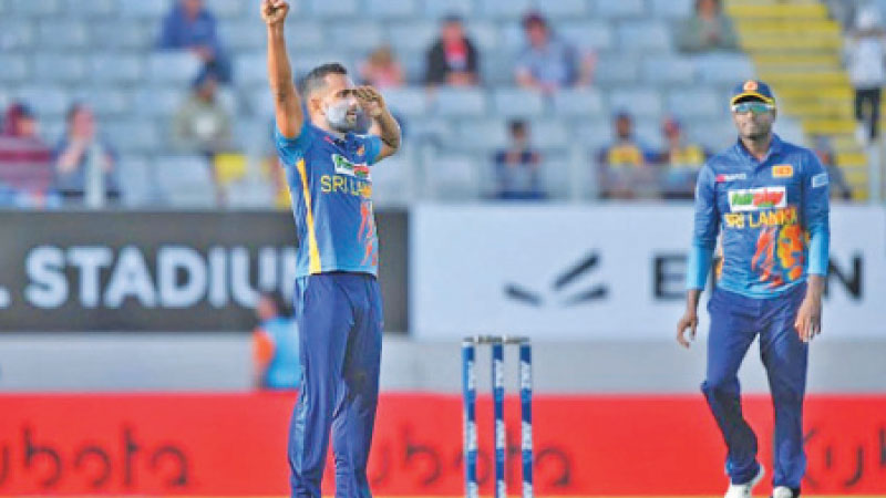 Sri Lankan all rounder Chamika Karunarathna celebrating a wicket during the first ODI with Angelo Mathews looking on.