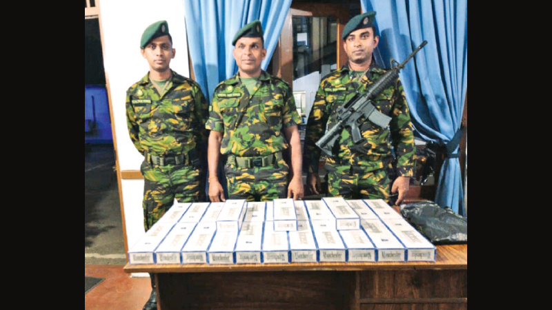 Special Task Force personnel with  contraband foreign cigarettes.