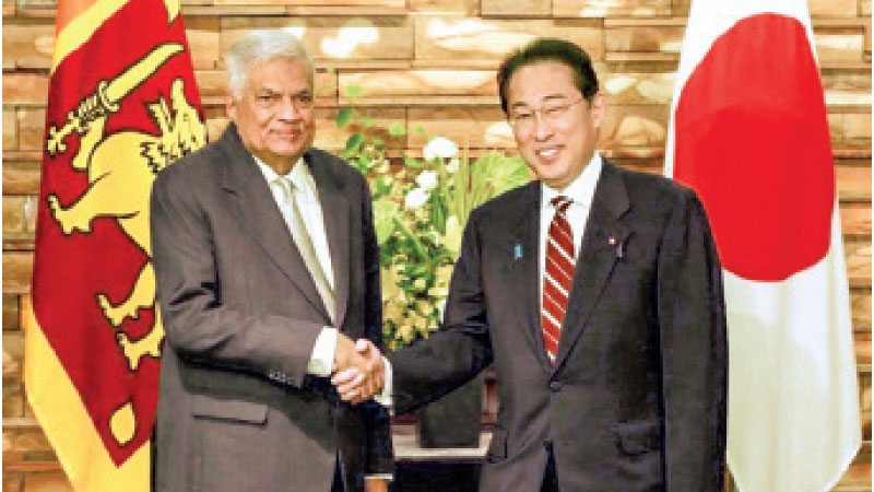 President Ranil Wickremesinghe greeting Japanese Prime Minister Fumio Kishida in Japan yesterday.