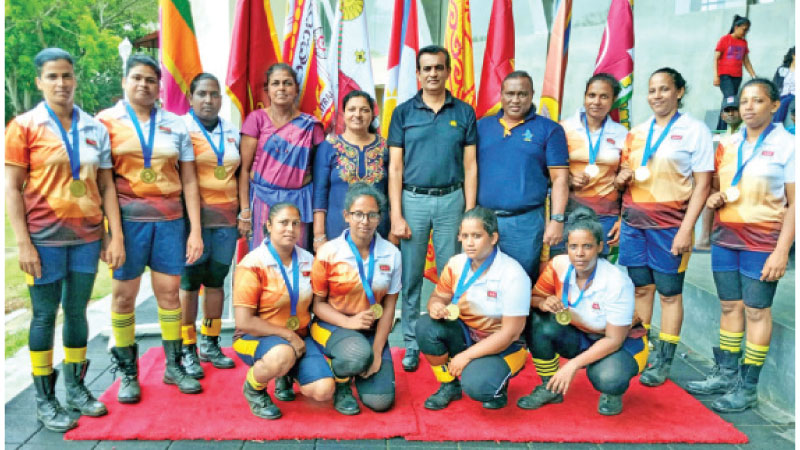 Champion Western Province women's Tug-O-War team with officials
