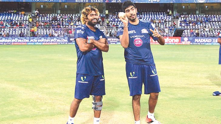 The master and the protégé: Lasith Malinga and Jasprit Bumrah have a chat during a Mumbai Indians training session on Saturday.