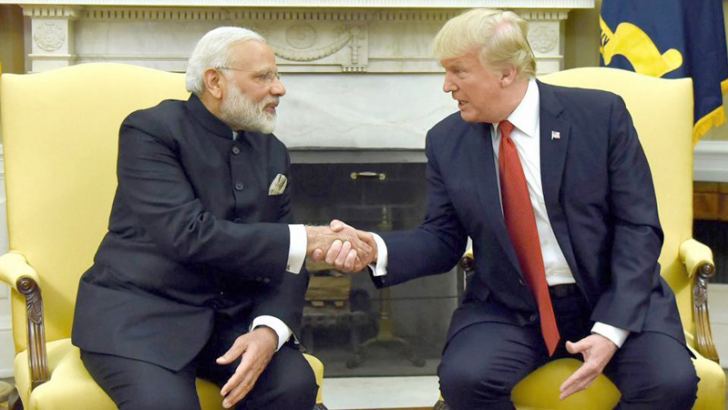 US President Donald Trump shakes hands with Indian Prime Minister Narendra Modi in the Oval Office of the White House in Washington on Monday. 
