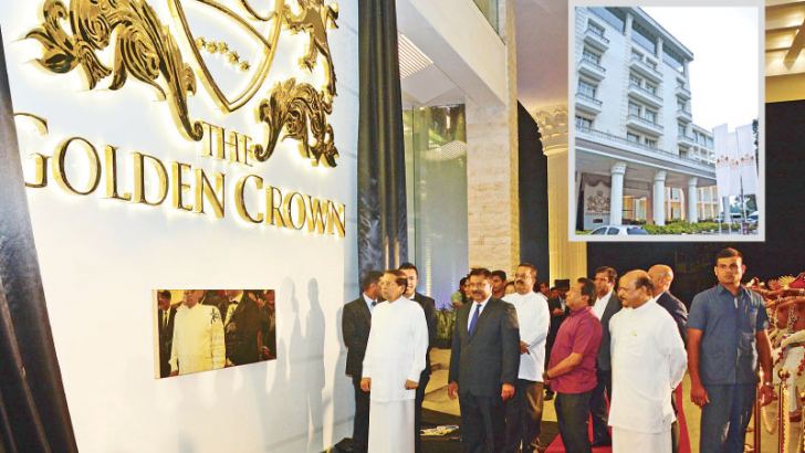 President Maithripala Sirisena after opening the Golden Crown Hotel Kandy on Saturday. Chairman of the owner company Serenine Hotels Ltd, Sriyananda Wijekoon and other officials look on. Pictures by Sudath Malaweera  