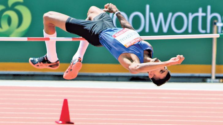 Manjula Kumara Wijesekara performing his 2.21-metre jump which earned him a place in the final round of men's high jump event of the XXI Commonwealth Games in Gold Coast, Australia.  Picture by Prince Gunasekara