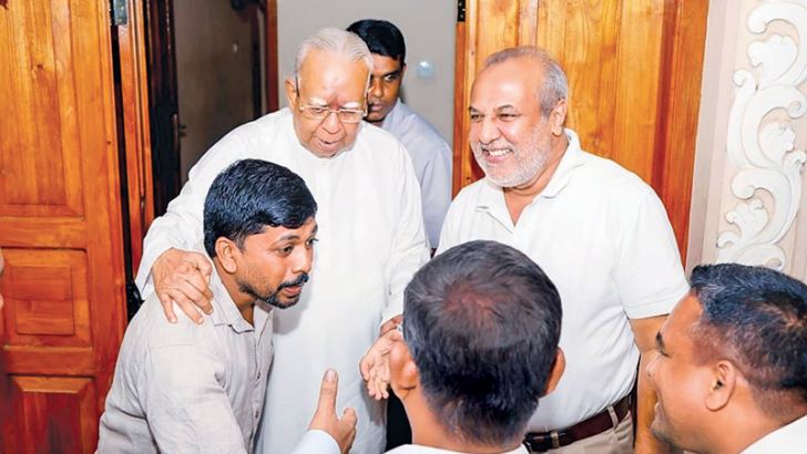 SLMC leader Minister Rauff Hakeem at the Trincomalee residence of Opposition and TNA Leader R. Sambandan on Monday. He met newly elected TNA members of local bodies too. Parliamentarian M. S. Thowfeek and party member H. M. Faiz were also present.