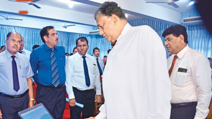Governor Rohitha Bogollagama opening the computer lab and online training management system