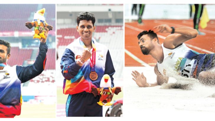 Charitha Buddhika showing his gold medal-Lal Pushpakumara won the bronze medal in men’s high jump-Charitha Buddhika’s winning jump in the men’s T42-44/61/63 long jump event. Pictures by Prince Gunasekara