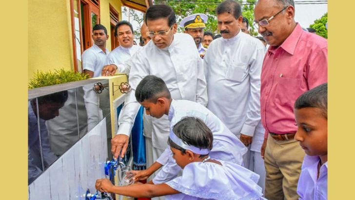 President Maithripala Sirisena inaugurating a drinking water project in Horowpothana recently. Picture by Sudath Silva