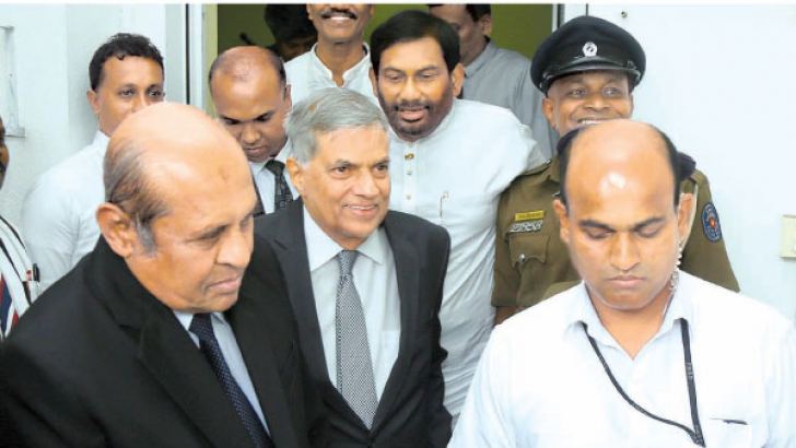 Prime Minister Ranil Wickremesinghe is seen leaving the Commission premises.  Ministers Thilak Marapana PC  and Daya Gamage are also in the picture. Picture by Hirantha Gunathilake