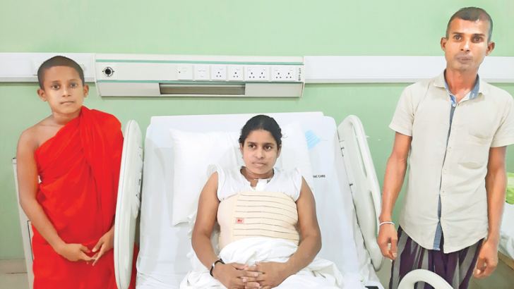 Fully recovered heart patient Chitra Irangani with her husband and son Samanera Bhikku  