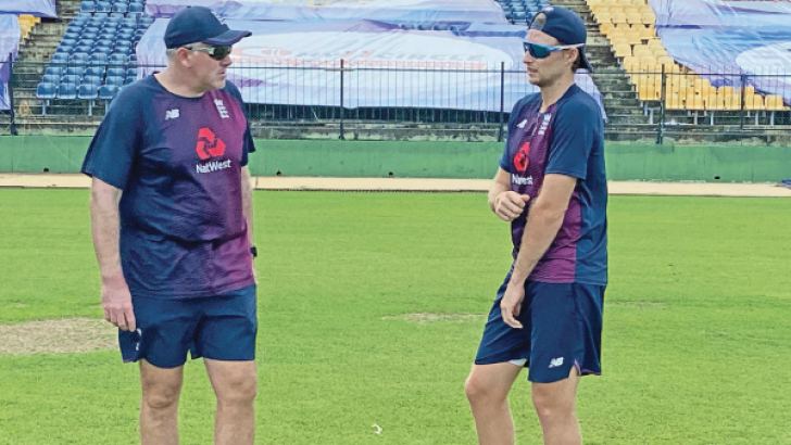 Coach Chris Silverwood (left) with Skipper Joe Root during a training session. 