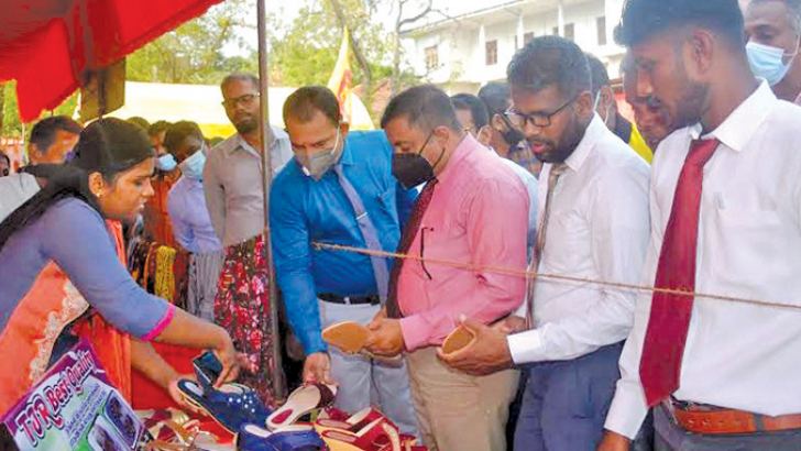 Ampara Additional District Secretary V. Jegatheesan and others inspecting the exhibits. Picture by I.L.M. Rizan, Addalaichenai Central Corr.