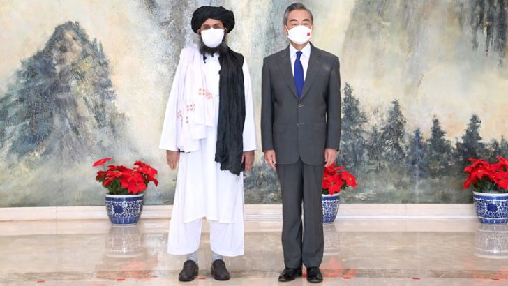 Chinese Foreign Minister Wang Yi with a senior Taliban representative