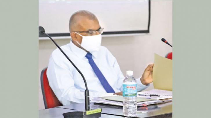 Anuradhapura Government Agent Janaka Jayasundara speaks at the progress review meeting. 