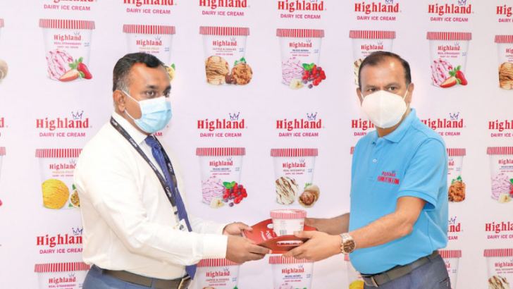 Arjuna Kumarashnghe Chief Commercial Officer Cargills Ceylon and S. Sarawanabavan Manager Marketing and Sales Milco Private Limited serving the latest Highland Ice-cream