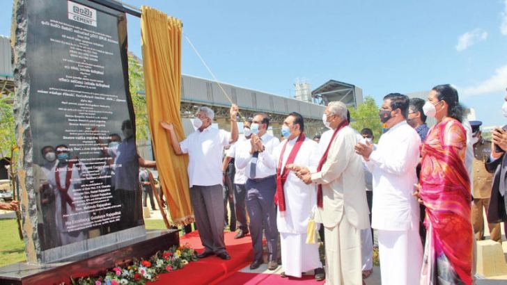 President Gotabaya Rajapaksa, Prime Minister Mahinda Rajapaksa and Minister Chamal Rajapaka opening the plaque looked on by ministers and officials.  Picture by Saliya Rupasinghe