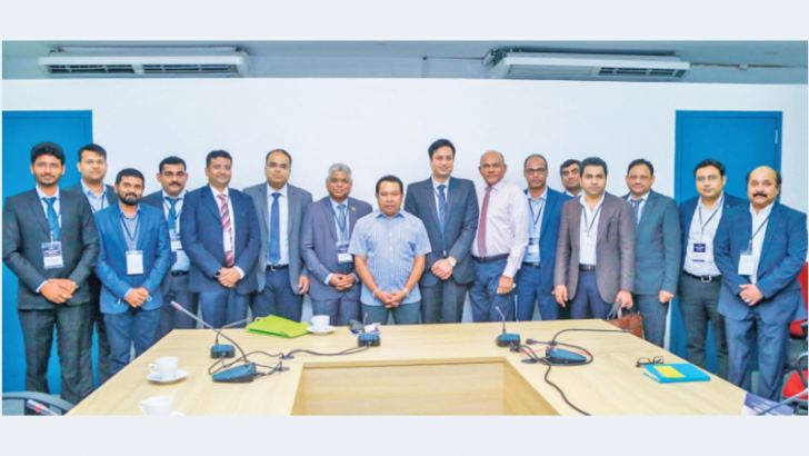 Industries Minister S.B. Dissanayake and Industries Secretary, General (Retd.) Daya Ratnayake with the group of Indian investors, at the Ministry, on Monday. 