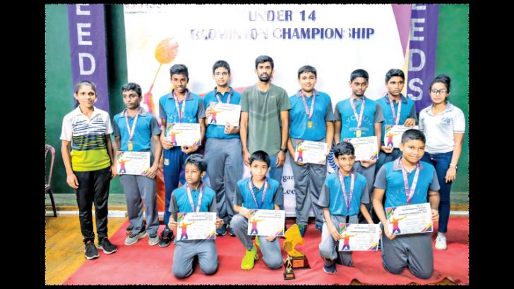 The victorious Lyceum International School, Panadura under-14  boys badminton team with officials.
