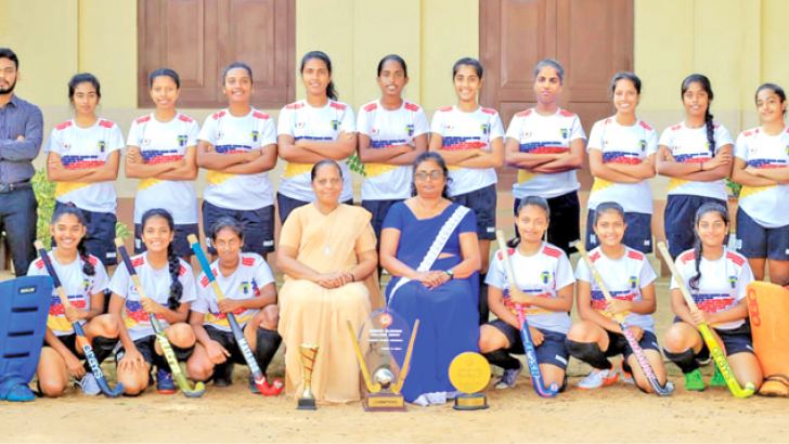 Holy Family Convent, Wennappuwa were the All Island under 19 Hockey Champions 2019 and they posed for a photograph after the finals with the officials of the school. (Picture by Dilwin Mendis Moratuwa Sports Special Correspondent)   