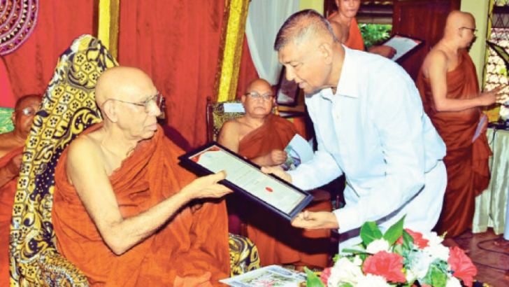   Retired DIG Daya De Fonseka being conferred with Sasana Keerthi honorary title by the Mahanayake Thera of Ramannaya Maha Nikaya Most Ven Makulewe Wimala Thera  in recognition of his service to the Buddha Sasana.